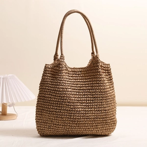 Handwoven brown straw tote bag for women, perfect for summer beach vacations and daily use
