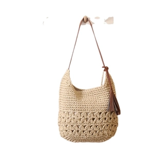 Bohemian hollow straw shoulder bag with leather tassels and woven beach style texture