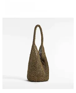 Detail of khaki crochet tote bag featuring vintage hollow-out pattern and single handle