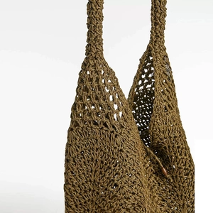 Chic hollow woven straw shoulder bag in olive green for seaside beach vacations