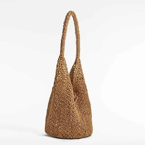 Hollow out woven straw shoulder bag with natural brown texture for summer beach vacation
