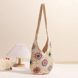 Bohemian crochet tote bag with colorful floral patterns and woven cotton shoulder strap