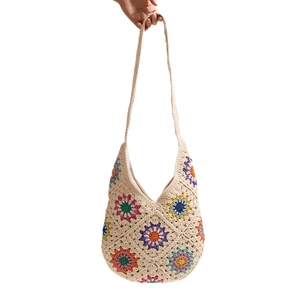 Bohemian crochet tote bag with colorful floral patterns for beach vacation and casual use