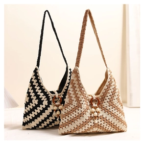 Detail of bohemian knit tote bags featuring zigzag patterns and wooden bead tassels