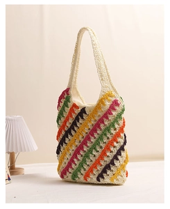 Detailed close-up of colorful zigzag crochet pattern on a woven straw shoulder bag