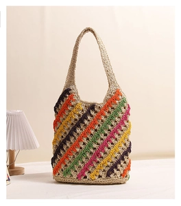 Detailed close-up of colorful striped crochet weave on handmade summer beach tote bag