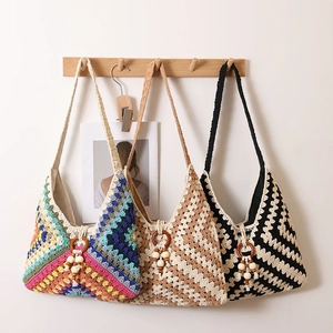 Set of bohemian crochet tote bags with granny square patterns and wooden bead tassels