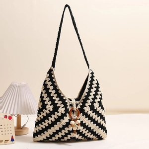 Ethnic knit shoulder bag with black and white wave pattern and wooden ring tassel