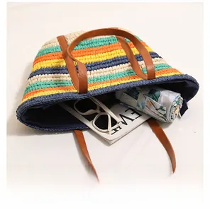 Top view of large capacity straw bag showing colorful stripes and interior storage space