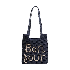 Navy blue woven tote bag with Bonjour embroidery, perfect for beach and summer vacations
