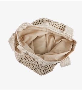 Top view of beige woven tote bag showing large capacity, inner lining, and magnetic closure