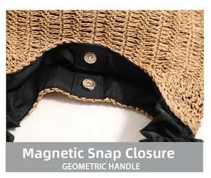 Detail view of straw woven bag with magnetic snap closure and black cloth lining