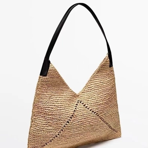 French style straw shoulder bag with V-shaped weave pattern and leather straps
