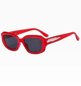 Detail of red thick-frame sunglasses with silver geometric inlay and dark UV lenses