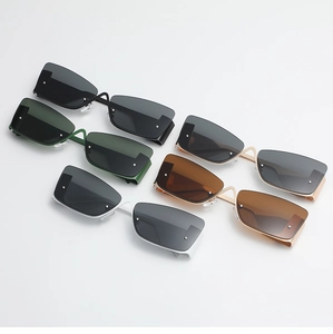 Flat lay view of various metallic semi-rimless cat-eye sunglasses with side shield detail