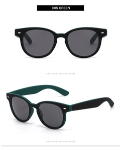 Detailsicht der ovalen, dunkelgrünen und schwarzen Sonnenbrille mit Metallnieten