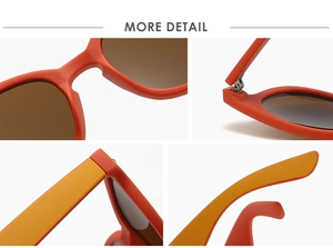 Detailansicht der orangefarbenen Sonnenbrille mit Metallscharnieren und Bügeln
