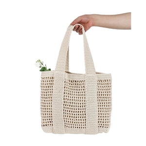 Cream crochet hollow mesh tote bag with wide straps for casual beach vacation style