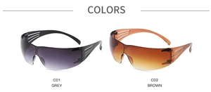 Detail view of oversized rimless Y2K sunglasses in grey and brown gradient colors
