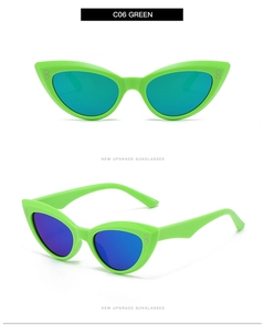Detail view of fluorescent green cat-eye sunglasses with blue-purple reflective lenses