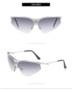 Détail de lunettes de soleil demi-cerclées argentées avec logo lune et verres dégradés