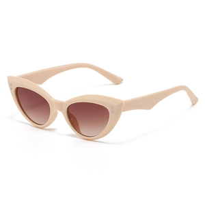 Fashionable beige cat eye sunglasses for women with brown gradient lenses and silver studs