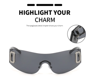 Detail view of oversized rimless grey sunglasses with metallic side frame accents