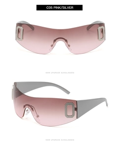 Detail view of pink gradient frameless sunglasses with rhinestone metal accents
