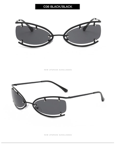 Gros plan sur les lunettes de soleil noires avant-gardistes avec monture en métal évidé