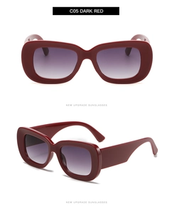Close-up of retro wide-frame sunglasses in dark red finish with gradient lenses