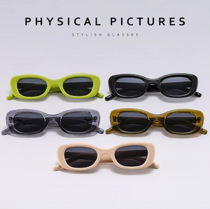 Flat lay of oval sunglasses in jelly colors including green, black, amber, and beige