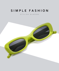 Détail macro de lunettes de soleil rectangulaires vert avocat au design simple