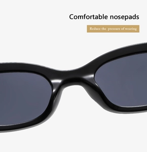 Détail des plaquettes de nez intégrées sur lunettes de soleil noires réduisant la pression