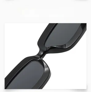 Detail view of reinforced sturdy nose pads on classic black rectangular sunglasses
