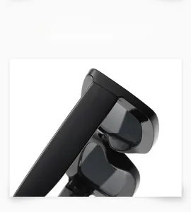 Detail view of the sleek black bold frame and hinge craftsmanship on these sunglasses