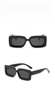 Front and side view of trendy black rectangular sunglasses with dark gray lenses