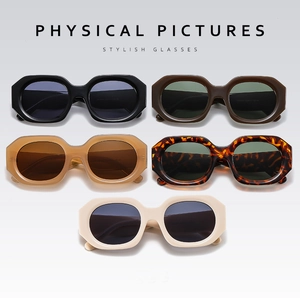 Five assorted colors of oversized polygonal sunglasses featuring thick acetate frames