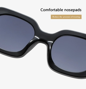 Close-up of integrated thickened nose pads on black wide-frame sunglasses for comfort