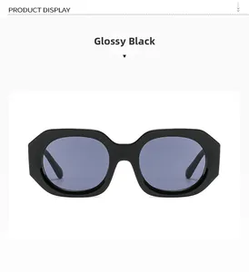 Detail of trendy black polygon sunglasses featuring thick frames and dark polarized lenses
