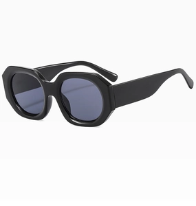 Detail view of bold polygonal wide temples and sturdy metal hinges on black sunglasses