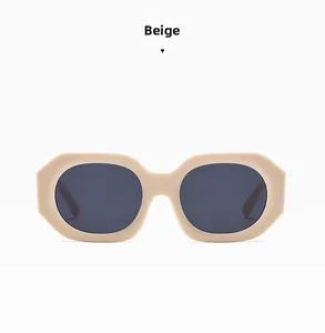 Detail view of beige chunky square sunglasses with thick temples and dark grey lenses