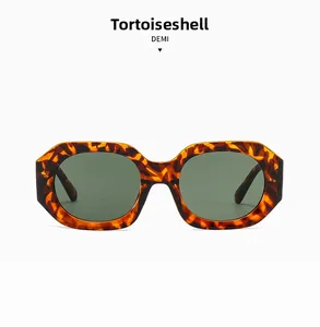 Front view of retro oversized polygon tortoise sunglasses with dark green lenses