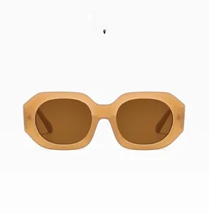 Detail of jelly brown polygonal sunglasses with thick frames and dark brown lenses