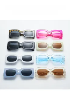 Flat lay of rectangular sunglasses in eight vibrant colors on a clean white background