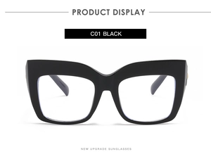 Detail view of large black cat-eye glasses frame with sleek polished finish