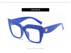 Detail of blue square oversized sunglasses with gold metal decorative temple accents