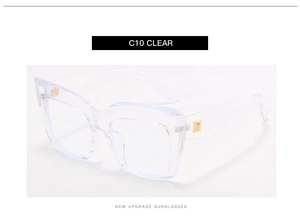 Detail view of transparent square frames with golden hinge accents and clear lenses