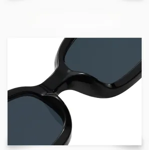 Close-up of sleek black square sunglasses showing sturdy integrated nose pads design