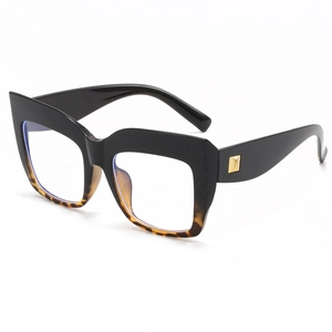 Oversized square black and tortoiseshell glasses frame with gold metal accents
