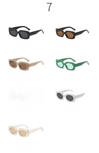 Flat lay of retro rectangle sunglasses in seven trendy candy colors for street style